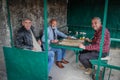 A group of older men are relaxing playing backgammon Royalty Free Stock Photo