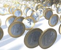 Group of one euro coins rolling past the viewer, blurry background Royalty Free Stock Photo