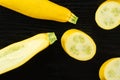 Fresh Raw yellow zucchini on black wood Royalty Free Stock Photo