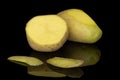 Raw brown potato isolated on black glass Royalty Free Stock Photo