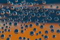 Group of orange and blue air bubbles in water Royalty Free Stock Photo