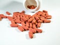 Group of orange medications, pills  on white background Royalty Free Stock Photo