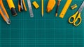 Group of stationery office supplies on cutting mat, flat lay picture. Royalty Free Stock Photo