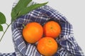 Group of oranges decorated with orange leaves