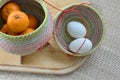 Group of oranges and duck egg in bamboo container Royalty Free Stock Photo