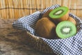 Group of organic fresh kiwi fruit in wooden basket Royalty Free Stock Photo