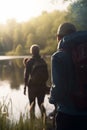 Exploring the Outdoors: Group Hiking and Camping by the River with Backpacks