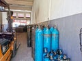 Group of oxygen cylinder tank with compressed gas for industrial use in the factory. Royalty Free Stock Photo