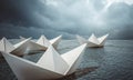 Group of paper boats sailing in open ocean