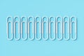 Group Paper clips on a blue background.