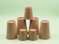 Group of paper cups on a green background Royalty Free Stock Photo