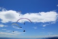 A group of paratroopers fly paragliding over the Italian Alps