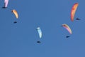 A group of paratroopers fly paragliding over the Italian Alps