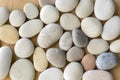 Group of pebbles, light colors, stone background, round and smooth pebbles Royalty Free Stock Photo