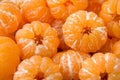 A group of peeled orange Clementine tangerines texture pattern b