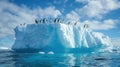 A group of penguins on the ice against a background of icebergs. Many penguins on an ice floe in the ocean Royalty Free Stock Photo