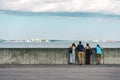 Group of people admiring the beautiful sea view from the embankment. Helsingor. Denmark. Relaxation. Royalty Free Stock Photo