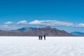 Group of people on an adventure on the desert salt flats of Utah.
