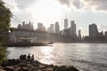 Group of People along the Shore of the East River Watching the Sunset over the Manhattan Skyline and Brooklyn Bridge Royalty Free Stock Photo
