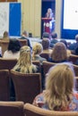 Group of People Attending Conference and Listening to the Host Speaker