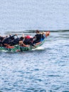 Group of people on beautiful boats during Asian traditional competition- the dragon race