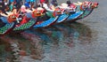 Group of people on beautiful boats during Asian traditional competition- the dragon race