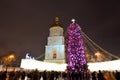 The group of people and the Bell Tower of Saint Sofias Cathedral and New Year Tree