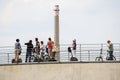 Group of people on bicycle and segway ride standing and talking on bridge over Spree River at Paul Loebe building Royalty Free Stock Photo