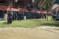 Group of people in black at funeral ceremony. Tana Toraja