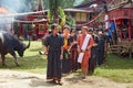 Group of people in black at funeral ceremony. Tana Toraja