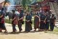 Group of people in black at funeral ceremony. Tana Toraja