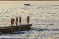 Group of People at Breakwater, Punta del Este, Uruguay Royalty Free Stock Photo