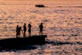 Group of People at Breakwater, Punta del Este, Uruguay Royalty Free Stock Photo