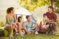 Group of people camping and singing Royalty Free Stock Photo