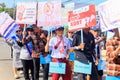 a group of people carrying banners