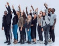 Casual group of excited friends with arms up isolated on white Royalty Free Stock Photo