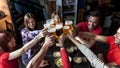 Group of people celebrating in a pub