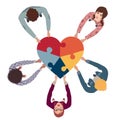 Group of people in circle top view multicultural volunteers holding a heart with puzzle pieces. NGO. Aid. Community of friends or Royalty Free Stock Photo