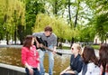 Group of people in city park listen music. Royalty Free Stock Photo