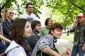 Group of people in city park listen music. Royalty Free Stock Photo