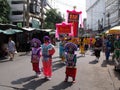A group of people with colorful dresses and banners in a Festival of the Clans of the Chinese community of Bangkok Royalty Free Stock Photo