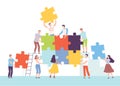Group of People Connecting Puzzle Elements, Business Team Assembling Puzzle, Solving Difficult Problem, Teamwork