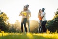 Group of people dancing Kizomba in sunset