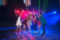 Group of people dancing at night club party and lights background. Royalty Free Stock Photo
