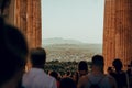 Group of people descending from the Acropolis in Athens towards the city, minimalistic