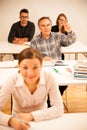 Group of people of different age sitting in classroom and attend