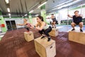 Group of people doing box jumps exercise in gym Royalty Free Stock Photo
