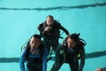 A group of people doing diving training in a swimming pool Royalty Free Stock Photo