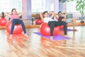 Group people doing exercise with fitness ball Royalty Free Stock Photo