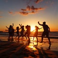 a group of people doing a flash mob dance on a beach at sunst Royalty Free Stock Photo